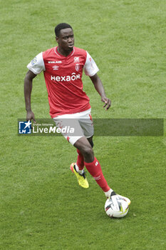 2024-04-07 - Joseph Okumu of Reims during the French championship Ligue 1 football match between Stade de Reims and OGC Nice (OGCN) on April 7, 2024 at Stade Auguste Delaune in Reims, France - FOOTBALL - FRENCH CHAMP - REIMS V NICE - FRENCH LIGUE 1 - SOCCER