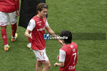 2024-04-07 - Keito Nakamura of Reims salutes Junya Ito of Reims following the French championship Ligue 1 football match between Stade de Reims and OGC Nice (OGCN) on April 7, 2024 at Stade Auguste Delaune in Reims, France - FOOTBALL - FRENCH CHAMP - REIMS V NICE - FRENCH LIGUE 1 - SOCCER