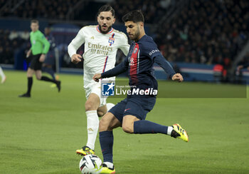 2024-04-21 - Marco Asensio of PSG, left Rayan Cherki of Lyon during the French championship Ligue 1 football match between Paris Saint-Germain and Olympique Lyonnais (Lyon) on April 21, 2024 at Parc des Princes stadium in Paris, France - FOOTBALL - FRENCH CHAMP - PARIS SG V LYON - FRENCH LIGUE 1 - SOCCER