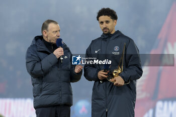 2024-04-21 - Marquinhos of PSG is honored for his record 436 matches played for PSG with PSG presenter Michel Montana (left) following the French championship Ligue 1 football match between Paris Saint-Germain and Olympique Lyonnais (Lyon) on April 21, 2024 at Parc des Princes stadium in Paris, France - FOOTBALL - FRENCH CHAMP - PARIS SG V LYON - FRENCH LIGUE 1 - SOCCER