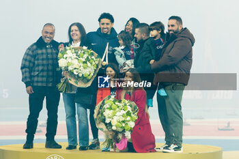 2024-04-21 - Marquinhos of PSG - here with his family - is honored for his record 436 matches played for PSG following the French championship Ligue 1 football match between Paris Saint-Germain and Olympique Lyonnais (Lyon) on April 21, 2024 at Parc des Princes stadium in Paris, France - FOOTBALL - FRENCH CHAMP - PARIS SG V LYON - FRENCH LIGUE 1 - SOCCER