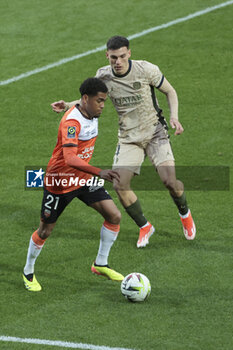2024-04-24 - Julien Ponceau of Lorient, Manuel Ugarte of PSG during the French championship Ligue 1 football match between FC Lorient and Paris Saint-Germain (PSG) on April 24, 2024 at Stade du Moustoir in Lorient, France - FOOTBALL - FRENCH CHAMP - LORIENT V PARIS SG - FRENCH LIGUE 1 - SOCCER