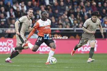 2024-04-24 - Ayman Kari of Lorient, Fabian Ruiz Pena, Lee Kang-in of PSG during the French championship Ligue 1 football match between FC Lorient and Paris Saint-Germain (PSG) on April 24, 2024 at Stade du Moustoir in Lorient, France - FOOTBALL - FRENCH CHAMP - LORIENT V PARIS SG - FRENCH LIGUE 1 - SOCCER