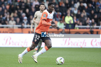 2024-04-24 - Nathaniel Adjei of Lorient during the French championship Ligue 1 football match between FC Lorient and Paris Saint-Germain (PSG) on April 24, 2024 at Stade du Moustoir in Lorient, France - FOOTBALL - FRENCH CHAMP - LORIENT V PARIS SG - FRENCH LIGUE 1 - SOCCER