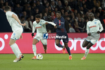 27/04/2024 - Christopher Operi of Le Havre, Ousmane Dembele of PSG, Abdoulaye Toure of Le Havre during the French championship Ligue 1 football match between Paris Saint-Germain (PSG) and Le Havre AC (HAC) on April 27, 2024 at Parc des Princes stadium in Paris, France - FOOTBALL - FRENCH CHAMP - PARIS SG V LE HAVRE - FRENCH LIGUE 1 - CALCIO