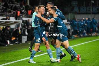 2024-11-23 - Valentin RONGIER of Marseille celebrate his goal with Pierre-Mason GREENWOOD of Marseille and Neal MAUPAY of Marseille during the French championship Ligue 1 football match between RC Lens and Olympique de Marseille on 23 November 2024 at Bollaert-Delelis stadium in Lens, France - FOOTBALL - FRENCH CHAMP - LENS V MARSEILLE - FRENCH LIGUE 1 - SOCCER