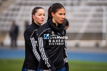 2024-01-14 - Margaux Le Mouel of Paris FC and Clara Mateo of Paris FC warm up ahead of the Women's French cup, round of 32 football match between Paris FC and Girondins de Bordeaux on January 14, 2024 at Sebastien Charlety stadium in Paris, France - FOOTBALL - WOMEN'S FRENCH CUP - PARIS FC V BORDEAUX - FRENCH WOMEN DIVISION 1 - SOCCER