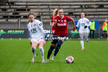 2024-02-14 - Dominika Grabowska of FC Fleury 91 and Marjorie Boilesen of LOSC Lille fight for the ball during the Women's French Cup, Quarter-final football match between FC Fleury 91 and Losc Lille on February 14, 2024 at Robert Bobin stadium in Bondoufle, France - FOOTBALL - WOMEN'S FRENCH CUP - FLEURY V LILLE - FRENCH WOMEN DIVISION 1 - SOCCER