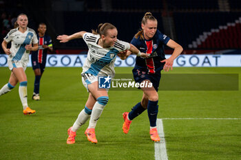 2024-05-11 - Julie Dufour of Paris FC and Jade Le Guilly of Paris Saint Germain fight for the ball during the Women's French championship, D1 Arkema, Play-offs Semi-final football match between Paris Saint-Germain and Paris FC on May 11, 2024 at Parc des Princes stadium in Paris, France - FOOTBALL - WOMEN'S FRENCH CHAMP - PARIS SG V PARIS FC - FRENCH WOMEN DIVISION 1 - SOCCER