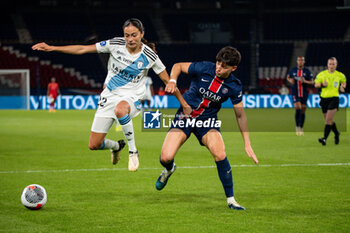 2024-05-11 - Kessya Bussy of Paris FC and Elisa De Almeida of Paris Saint Germain fight for the ball during the Women's French championship, D1 Arkema, Play-offs Semi-final football match between Paris Saint-Germain and Paris FC on May 11, 2024 at Parc des Princes stadium in Paris, France - FOOTBALL - WOMEN'S FRENCH CHAMP - PARIS SG V PARIS FC - FRENCH WOMEN DIVISION 1 - SOCCER