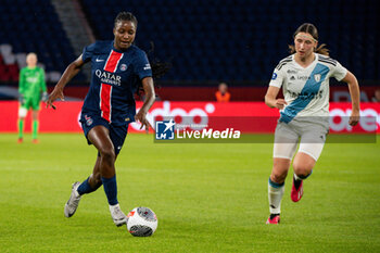 2024-05-11 - Thiniba Samoura of Paris Saint Germain and Kaja Korosec of Paris FC fight for the ball during the Women's French championship, D1 Arkema, Play-offs Semi-final football match between Paris Saint-Germain and Paris FC on May 11, 2024 at Parc des Princes stadium in Paris, France - FOOTBALL - WOMEN'S FRENCH CHAMP - PARIS SG V PARIS FC - FRENCH WOMEN DIVISION 1 - SOCCER