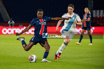 2024-05-11 - Thiniba Samoura of Paris Saint Germain and Kaja Korosec of Paris FC fight for the ball during the Women's French championship, D1 Arkema, Play-offs Semi-final football match between Paris Saint-Germain and Paris FC on May 11, 2024 at Parc des Princes stadium in Paris, France - FOOTBALL - WOMEN'S FRENCH CHAMP - PARIS SG V PARIS FC - FRENCH WOMEN DIVISION 1 - SOCCER