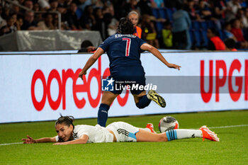 2024-05-11 - Clara Mateo of Paris FC and Sakina Karchaoui of Paris Saint Germain fight for the ball during the Women's French championship, D1 Arkema, Play-offs Semi-final football match between Paris Saint-Germain and Paris FC on May 11, 2024 at Parc des Princes stadium in Paris, France - FOOTBALL - WOMEN'S FRENCH CHAMP - PARIS SG V PARIS FC - FRENCH WOMEN DIVISION 1 - SOCCER