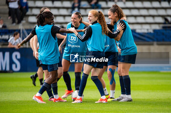 2024-05-17 - Louise Fleury of Paris FC, Celina Ould Hocine of Paris FC and Louna Ribadeira of Paris FC warm up ahead of the Women's French championship, Play-offs, 3rd place football match between Paris FC and Stade de Reims on May 17, 2024 at Sébastien Charléty stadium in Paris, France - FOOTBALL - WOMEN'S FRENCH CHAMP - 3RD PLACE - PARIS FC V REIMS - FRENCH WOMEN DIVISION 1 - SOCCER