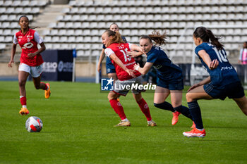 2024-05-17 - Lou Ann Joly of Stade de Reims and Julie Dufour of Paris FC fight for the ball during the Women's French championship, Play-offs, 3rd place football match between Paris FC and Stade de Reims on May 17, 2024 at Sébastien Charléty stadium in Paris, France - FOOTBALL - WOMEN'S FRENCH CHAMP - 3RD PLACE - PARIS FC V REIMS - FRENCH WOMEN DIVISION 1 - SOCCER