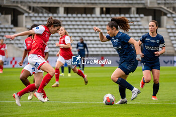 2024-05-17 - Julie Pasquereau of Stade de Reims and Louna Ribadeira of Paris FC fight for the ball during the Women's French championship, Play-offs, 3rd place football match between Paris FC and Stade de Reims on May 17, 2024 at Sébastien Charléty stadium in Paris, France - FOOTBALL - WOMEN'S FRENCH CHAMP - 3RD PLACE - PARIS FC V REIMS - FRENCH WOMEN DIVISION 1 - SOCCER