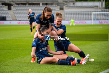 2024-05-17 - Clara Mateo of Paris FC celebrates after scoring with Gaetane Thiney of Paris FC and Thea Greboval of Paris FC during the Women's French championship, Play-offs, 3rd place football match between Paris FC and Stade de Reims on May 17, 2024 at Sébastien Charléty stadium in Paris, France - FOOTBALL - WOMEN'S FRENCH CHAMP - 3RD PLACE - PARIS FC V REIMS - FRENCH WOMEN DIVISION 1 - SOCCER