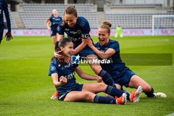 2024-05-17 - Clara Mateo of Paris FC celebrates after scoring with Gaetane Thiney of Paris FC and Thea Greboval of Paris FC during the Women's French championship, Play-offs, 3rd place football match between Paris FC and Stade de Reims on May 17, 2024 at Sébastien Charléty stadium in Paris, France - FOOTBALL - WOMEN'S FRENCH CHAMP - 3RD PLACE - PARIS FC V REIMS - FRENCH WOMEN DIVISION 1 - SOCCER