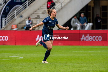 2024-05-17 - Thea Greboval of Paris FC celebrate the victory after the Women's French championship, Play-offs, 3rd place football match between Paris FC and Stade de Reims on May 17, 2024 at Sébastien Charléty stadium in Paris, France - FOOTBALL - WOMEN'S FRENCH CHAMP - 3RD PLACE - PARIS FC V REIMS - FRENCH WOMEN DIVISION 1 - SOCCER