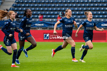 2024-05-17 - Teninsoun Sissoko of Paris FC, Louise Fleury of Paris FC and Thea Greboval of Paris FC celebrate the victory after the Women's French championship, Play-offs, 3rd place football match between Paris FC and Stade de Reims on May 17, 2024 at Sébastien Charléty stadium in Paris, France - FOOTBALL - WOMEN'S FRENCH CHAMP - 3RD PLACE - PARIS FC V REIMS - FRENCH WOMEN DIVISION 1 - SOCCER