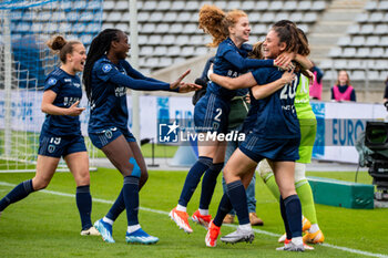 2024-05-17 - Celina Ould Hocine of Paris FC and Louna Ribadeira of Paris FC celebrate the victory after the Women's French championship, Play-offs, 3rd place football match between Paris FC and Stade de Reims on May 17, 2024 at Sébastien Charléty stadium in Paris, France - FOOTBALL - WOMEN'S FRENCH CHAMP - 3RD PLACE - PARIS FC V REIMS - FRENCH WOMEN DIVISION 1 - SOCCER