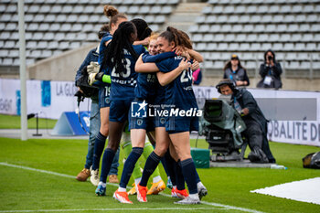 2024-05-17 - Celina Ould Hocine of Paris FC and Louna Ribadeira of Paris FC celebrate the victory after the Women's French championship, Play-offs, 3rd place football match between Paris FC and Stade de Reims on May 17, 2024 at Sébastien Charléty stadium in Paris, France - FOOTBALL - WOMEN'S FRENCH CHAMP - 3RD PLACE - PARIS FC V REIMS - FRENCH WOMEN DIVISION 1 - SOCCER