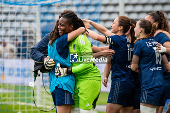 2024-05-17 - Clara Mateo of Paris FC and Chiamaka Nnadozie of Paris FC celebrate the victory after the Women's French championship, Play-offs, 3rd place football match between Paris FC and Stade de Reims on May 17, 2024 at Sébastien Charléty stadium in Paris, France - FOOTBALL - WOMEN'S FRENCH CHAMP - 3RD PLACE - PARIS FC V REIMS - FRENCH WOMEN DIVISION 1 - SOCCER