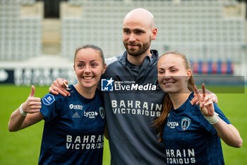 2024-05-17 - Margaux Le Mouel of Paris FC and Julie Dufour of Paris FC celebrate the victory after the Women's French championship, Play-offs, 3rd place football match between Paris FC and Stade de Reims on May 17, 2024 at Sébastien Charléty stadium in Paris, France - FOOTBALL - WOMEN'S FRENCH CHAMP - 3RD PLACE - PARIS FC V REIMS - FRENCH WOMEN DIVISION 1 - SOCCER