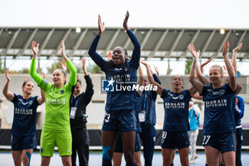 2024-05-17 - Teninsoun Sissoko of Paris FC celebrates the victory with teammates after the Women's French championship, Play-offs, 3rd place football match between Paris FC and Stade de Reims on May 17, 2024 at Sébastien Charléty stadium in Paris, France - FOOTBALL - WOMEN'S FRENCH CHAMP - 3RD PLACE - PARIS FC V REIMS - FRENCH WOMEN DIVISION 1 - SOCCER