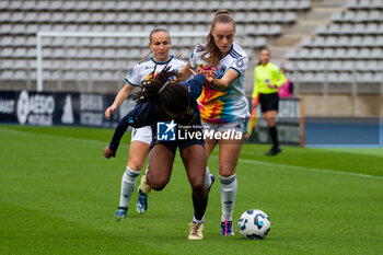 2024-10-12 - Mia Gyau of Stade de Reims and Lou Bogaert of Paris FC fight for the ball during the French championship, Arkema Premier Ligue football match between Paris FC and Stade de Reims on 12 October 2024 at Sebastien Charlety stadium in Paris, France - FOOTBALL - WOMEN'S FRENCH CHAMP - PARIS FC V REIMS - FRENCH WOMEN DIVISION 1 - SOCCER