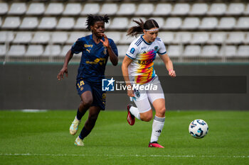 2024-10-12 - Monique Ngock of Stade de Reims and Kaja Korosec of Paris FC fight for the ball during the French championship, Arkema Premier Ligue football match between Paris FC and Stade de Reims on 12 October 2024 at Sebastien Charlety stadium in Paris, France - FOOTBALL - WOMEN'S FRENCH CHAMP - PARIS FC V REIMS - FRENCH WOMEN DIVISION 1 - SOCCER