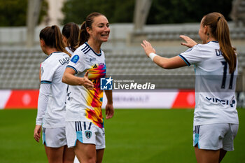 2024-10-12 - Gaetane Thiney of Paris FC celebrates the goal with Julie Dufour of Paris FC during the French championship, Arkema Premier Ligue football match between Paris FC and Stade de Reims on 12 October 2024 at Sebastien Charlety stadium in Paris, France - FOOTBALL - WOMEN'S FRENCH CHAMP - PARIS FC V REIMS - FRENCH WOMEN DIVISION 1 - SOCCER