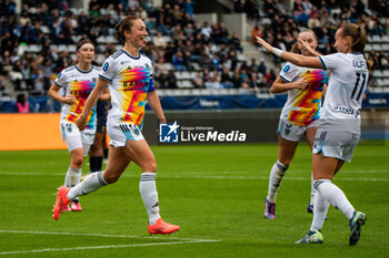 2024-10-12 - Gaetane Thiney of Paris FC celebrates after scoring with Julie Dufour of Paris FC during the French championship, Arkema Premier Ligue football match between Paris FC and Stade de Reims on 12 October 2024 at Sebastien Charlety stadium in Paris, France - FOOTBALL - WOMEN'S FRENCH CHAMP - PARIS FC V REIMS - FRENCH WOMEN DIVISION 1 - SOCCER