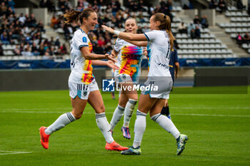 2024-10-12 - Gaetane Thiney of Paris FC celebrates after scoring with Julie Dufour of Paris FC during the French championship, Arkema Premier Ligue football match between Paris FC and Stade de Reims on 12 October 2024 at Sebastien Charlety stadium in Paris, France - FOOTBALL - WOMEN'S FRENCH CHAMP - PARIS FC V REIMS - FRENCH WOMEN DIVISION 1 - SOCCER