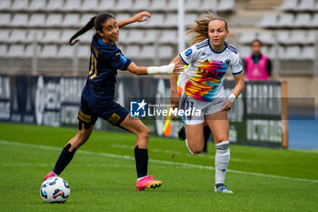 2024-10-12 - Jade Nassi of Stade de Reims and Julie Dufour of Paris FC fight for the ball during the French championship, Arkema Premier Ligue football match between Paris FC and Stade de Reims on 12 October 2024 at Sebastien Charlety stadium in Paris, France - FOOTBALL - WOMEN'S FRENCH CHAMP - PARIS FC V REIMS - FRENCH WOMEN DIVISION 1 - SOCCER