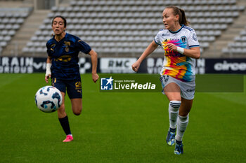 2024-10-12 - Jade Nassi of Stade de Reims and Julie Dufour of Paris FC fight for the ball during the French championship, Arkema Premier Ligue football match between Paris FC and Stade de Reims on 12 October 2024 at Sebastien Charlety stadium in Paris, France - FOOTBALL - WOMEN'S FRENCH CHAMP - PARIS FC V REIMS - FRENCH WOMEN DIVISION 1 - SOCCER