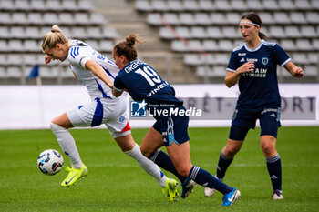 2024-10-20 - Ada Hegerberg of Olympique Lyonnais and Thea Greboval of Paris FC fight for the ball during the Women's French championship, Arkema Premier Ligue football match between Paris FC and Olympique Lyonnais on 20 October 2024 at Sebastien Charlety stadium in Paris, France - FOOTBALL - WOMEN'S FRENCH CHAMP - PARIS FC V LYON - FRENCH WOMEN DIVISION 1 - SOCCER