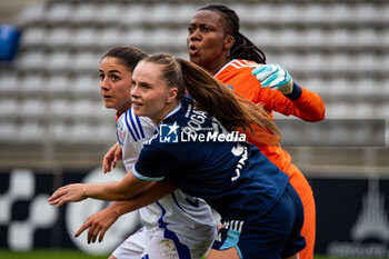 2024-10-20 - Danielle Van de Donk of Olympique Lyonnais, Lou Bogaert of Paris FC and Chiamaka Nnadozie of Paris FC fight for the ball during the Women's French championship, Arkema Premier Ligue football match between Paris FC and Olympique Lyonnais on 20 October 2024 at Sebastien Charlety stadium in Paris, France - FOOTBALL - WOMEN'S FRENCH CHAMP - PARIS FC V LYON - FRENCH WOMEN DIVISION 1 - SOCCER