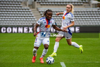 2024-10-20 - Melchie Dumornay of Olympique Lyonnais and Ellie Carpenter of Olympique Lyonnais during the Women's French championship, Arkema Premier Ligue football match between Paris FC and Olympique Lyonnais on 20 October 2024 at Sebastien Charlety stadium in Paris, France - FOOTBALL - WOMEN'S FRENCH CHAMP - PARIS FC V LYON - FRENCH WOMEN DIVISION 1 - SOCCER