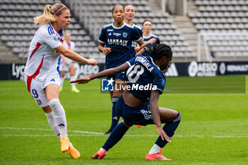 2024-10-20 - Eugenie Le Sommer of Olympique Lyonnais and Melwenn N Dongala of Paris FC fight for the ball during the Women's French championship, Arkema Premier Ligue football match between Paris FC and Olympique Lyonnais on 20 October 2024 at Sebastien Charlety stadium in Paris, France - FOOTBALL - WOMEN'S FRENCH CHAMP - PARIS FC V LYON - FRENCH WOMEN DIVISION 1 - SOCCER