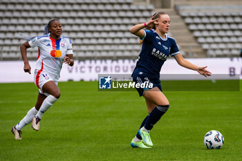 2024-10-20 - Kadidiatou Diani of Olympique Lyonnais and Lou Bogaert of Paris FC fight for the ball during the Women's French championship, Arkema Premier Ligue football match between Paris FC and Olympique Lyonnais on 20 October 2024 at Sebastien Charlety stadium in Paris, France - FOOTBALL - WOMEN'S FRENCH CHAMP - PARIS FC V LYON - FRENCH WOMEN DIVISION 1 - SOCCER