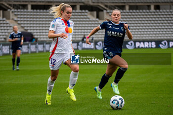 2024-10-20 - Ellie Carpenter of Olympique Lyonnais and Lou Bogaert of Paris FC fight for the ball during the Women's French championship, Arkema Premier Ligue football match between Paris FC and Olympique Lyonnais on 20 October 2024 at Sebastien Charlety stadium in Paris, France - FOOTBALL - WOMEN'S FRENCH CHAMP - PARIS FC V LYON - FRENCH WOMEN DIVISION 1 - SOCCER