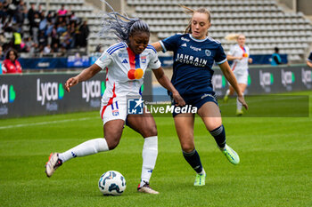 2024-10-20 - Kadidiatou Diani of Olympique Lyonnais and Lou Bogaert of Paris FC fight for the ball during the Women's French championship, Arkema Premier Ligue football match between Paris FC and Olympique Lyonnais on 20 October 2024 at Sebastien Charlety stadium in Paris, France - FOOTBALL - WOMEN'S FRENCH CHAMP - PARIS FC V LYON - FRENCH WOMEN DIVISION 1 - SOCCER