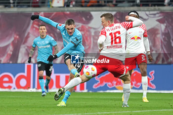 2024-01-20 - Florian Wirtz of Leverkusen and Lukas Klostermann of Leipzig during the German championship Bundesliga football match between RB Leipzig and Bayer 04 Leverkusen on January 20, 2024 at Red Bull Arena in Leipzig, Germany - FOOTBALL - GERMAN CHAMP - LEIPZIG V LEVERKUSEN - GERMAN BUNDESLIGA - SOCCER