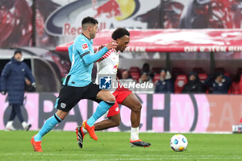 2024-01-20 - Lois Openda of Leipzig and Exequiel Palacios of Leverkusen during the German championship Bundesliga football match between RB Leipzig and Bayer 04 Leverkusen on January 20, 2024 at Red Bull Arena in Leipzig, Germany - FOOTBALL - GERMAN CHAMP - LEIPZIG V LEVERKUSEN - GERMAN BUNDESLIGA - SOCCER