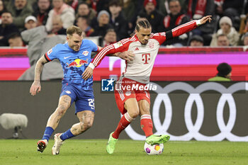 2024-02-24 - Leroy Sane of Bayern Munich and David Raum of RB Leipzig during the German championship Bundesliga football match between Bayern Munich and RB Leipzig on February 24, 2024 at Allianz Arena in Munich, Germany - FOOTBALL - GERMAN CHAMP - BAYERN MUNICH V LEIPZIG - GERMAN BUNDESLIGA - SOCCER