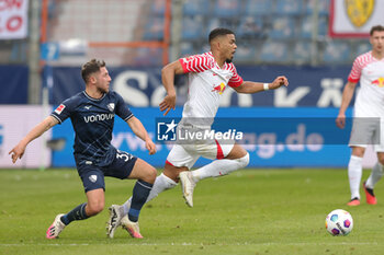 2024-03-02 - Benjamin Henrichs of Leipzig and Maximilian Wittek of Bochum during the German championship Bundesliga football match between VfL Bochum and RB Leipzig on March 2, 2024 at Vonovia Ruhrstadion in Bochum, Germany - FOOTBALL - GERMAN CHAMP - BOCHUM V RB LEIPZIG - GERMAN BUNDESLIGA - SOCCER