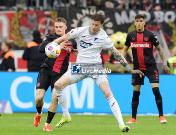 2024-03-30 - Florian Wirtz of Leverkusen and Wout Weghorst of Hoffenheim during the German championship Bundesliga football match between Bayer 04 Leverkusen and TSG Hoffenheim on March 30, 2024 at BayArena in Leverkusen, Germany - FOOTBALL - GERMAN CHAMP - LEVERKUSEN V HOFFENHEIM - GERMAN BUNDESLIGA - SOCCER