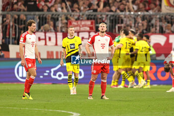 2024-03-30 - Leon Goretzka and Matthijs de Ligt of Bayern Munich look dejected during the German championship Bundesliga football match between Bayern Munich and Borussia Dortmund on March 30, 2024 at Allianz Arena in Munich, Germany - FOOTBALL - GERMAN CHAMP - BAYERN MUNICH V DORTMUND - GERMAN BUNDESLIGA - SOCCER