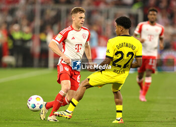 2024-03-30 - Joshua Kimmich of Bayern Munich and Ian Maatsen of Borussia Dortmund during the German championship Bundesliga football match between Bayern Munich and Borussia Dortmund on March 30, 2024 at Allianz Arena in Munich, Germany - FOOTBALL - GERMAN CHAMP - BAYERN MUNICH V DORTMUND - GERMAN BUNDESLIGA - SOCCER